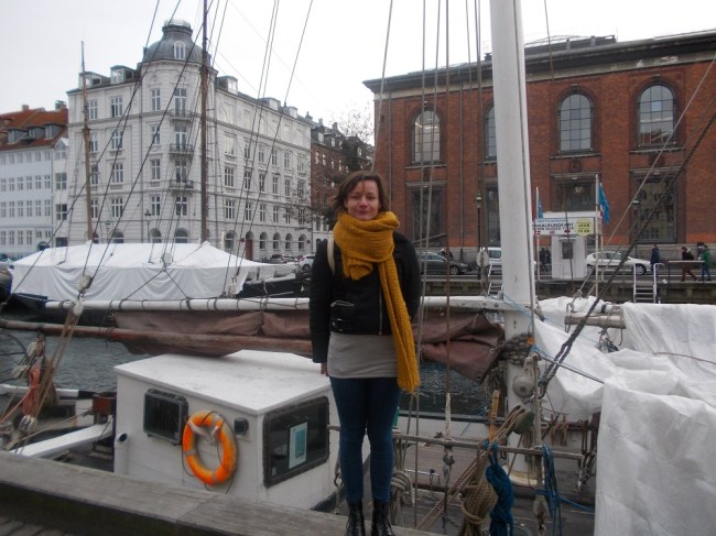 Joanna standing on a boat