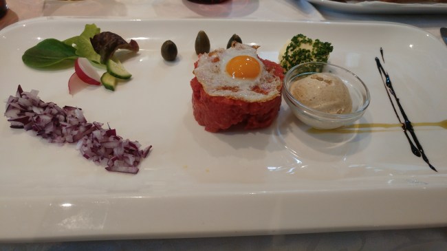 Beef tartare with quail's egg and horseradish ice cream